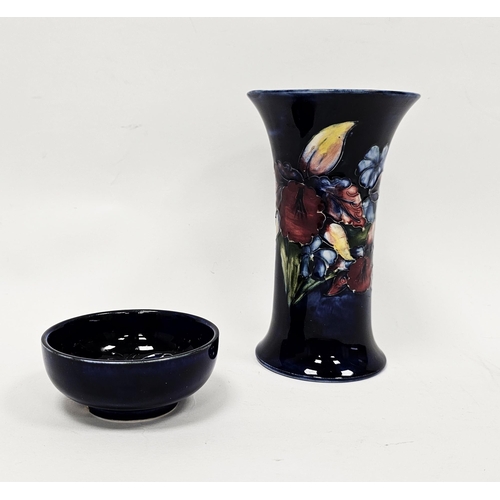 69 - Moorcroft blue-ground Iris pattern flared cylindrical vase and a small blue trinket dish, printed an... 