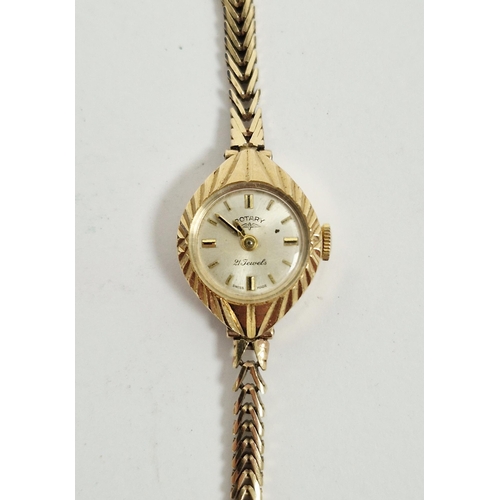 708 - Lady’s Rotary 9ct gold wristwatch, the circular face with engraved case, on integral herringbone-pat... 