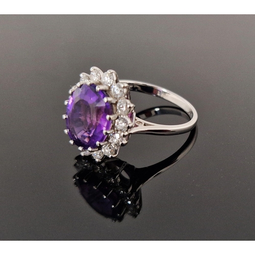 758 - 18ct gold, amethyst and diamond cluster ring, the oval amethyst 11.9mm x 9.9mm x 6.4mm deep surround... 