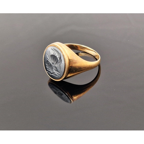 785 - 9ct gold and haematite signet ring, the oval haematite engraved with centurion's head