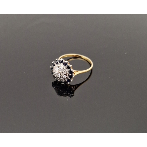 806 - 18ct gold, modern sapphire and diamond cluster ring set small diamond surrounded by sapphires