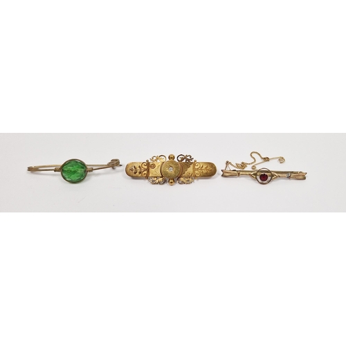 815 - LOT WITHDRAWN 
 9ct gold bar brooch, pierced with garnet-coloured stone to the centre, a Victorian 1... 