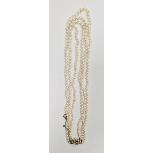 824 - LOT WITHDRAWN
 Triple string of graduated pearls with 9ct gold, pearl and garnet clasp