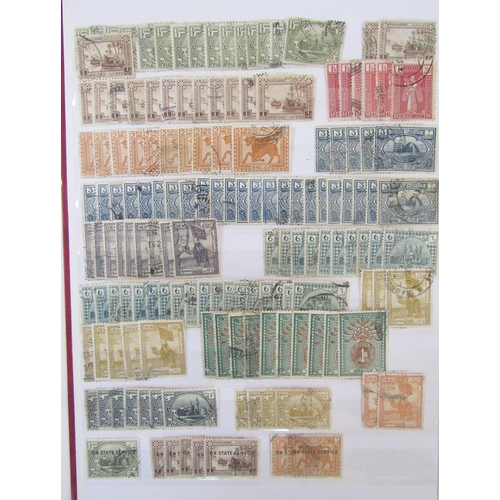 158 - Iraq stamps: Red stock-book half filled with mainly used definitives, commemoratives, officials and ... 