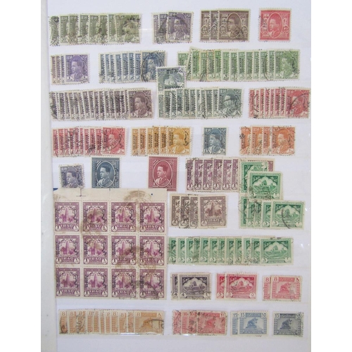 158 - Iraq stamps: Red stock-book half filled with mainly used definitives, commemoratives, officials and ... 