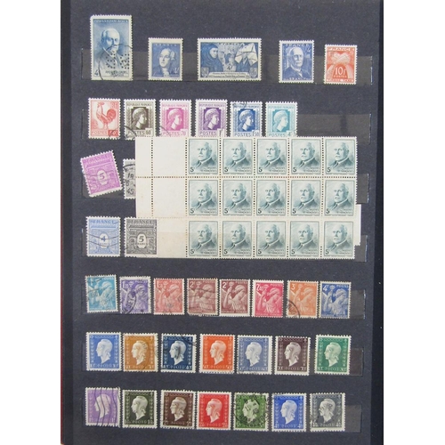 173 - Stamps of France: Red stockbook of mint and used definitives, commemoratives, Red Cross, exposition ... 