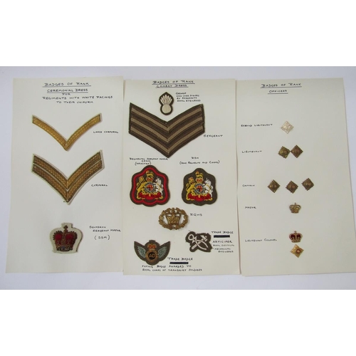 225 - Collection of British Army cap badges, cloth badges, rank markings and shooting medals.