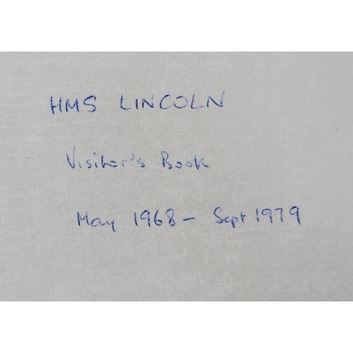 242 - Leather covered visitor's book for the frigate HMS Lincoln, together with a framed crest.