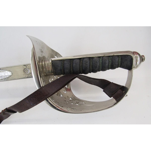 253 - George V officer's dress sword with leather scabbard and cover, officer's Sam Brown leather belt wit... 