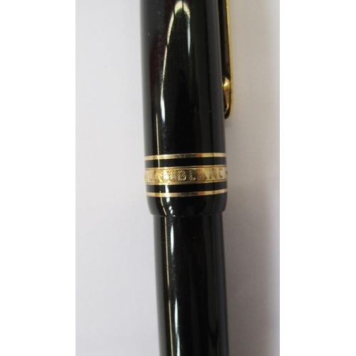 362 - Montblanc Meisterstuck fountain pen, black with gold band decoration, the lid with engraved Lion cre... 