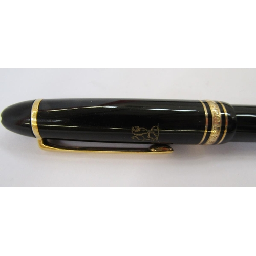 362 - Montblanc Meisterstuck fountain pen, black with gold band decoration, the lid with engraved Lion cre... 