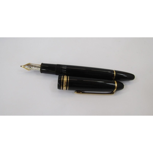 362 - Montblanc Meisterstuck fountain pen, black with gold band decoration, the lid with engraved Lion cre... 