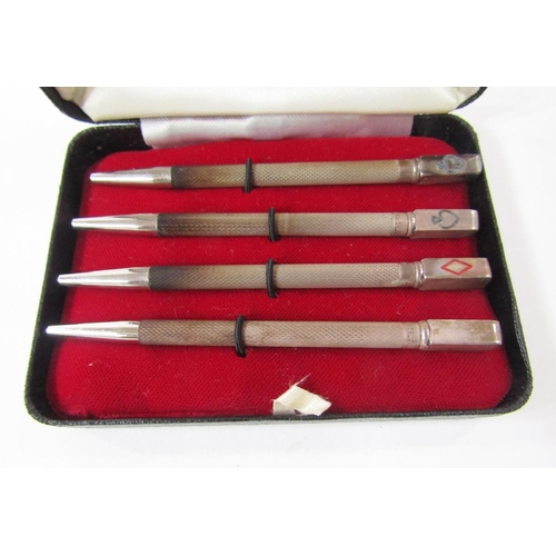 368 - Set of four sterling silver enamelled bridge pencils, each engine-turned with rectangular terminal e... 