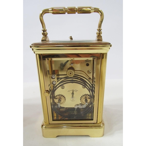 392 - Dunhill brass repeater carriage clock having engine-turned face surrounding a white enamel dial, pla... 