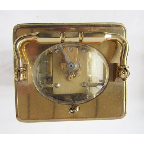 392 - Dunhill brass repeater carriage clock having engine-turned face surrounding a white enamel dial, pla... 