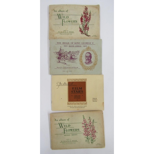 428 - Cigarette and tea cards in four albums to include Brooke Bond Tea, John Player & Sons Characters fro... 