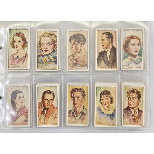 447 - Collection of 11 cigarette card part sets ring binder albums including numerous sets by Wills such a... 