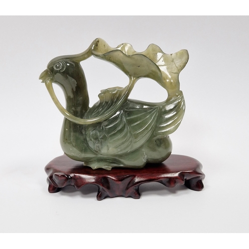 115 - Chinese carved spinach jade model of a mandarin duck, 10cm high x 9.5cm wide and the carved hardwood... 