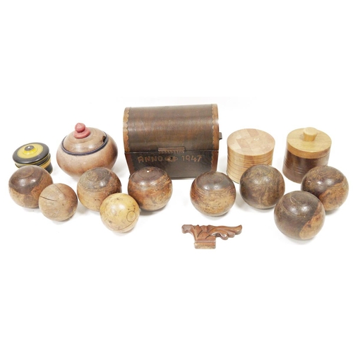 144 - Mixed lot of wooden items including seven Lignum Vitae bowling balls, two treen skittle balls, 1940'... 