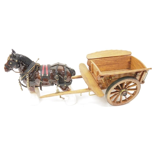 170 - Three ceramic shire horses in harness with three wooden carts