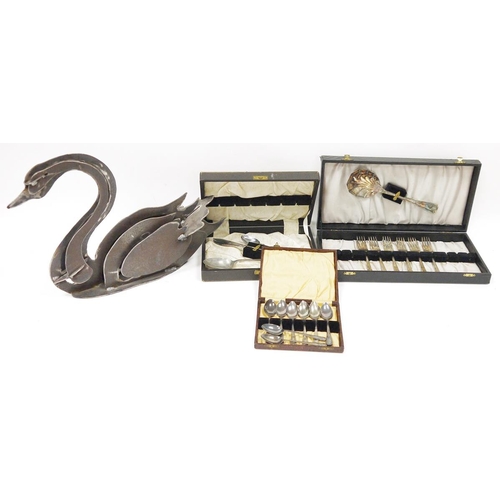 171 - Metal letter rack in the form of a swan 29cm high and three cased part cutlery sets