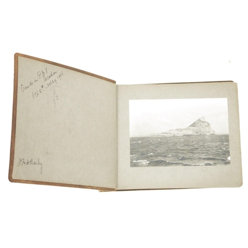 172 - Crocodile skin photograph album containing approximately 42 black and white photographs dating aroun... 