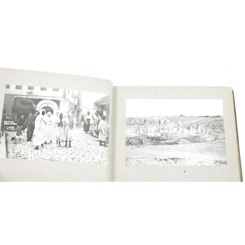 172 - Crocodile skin photograph album containing approximately 42 black and white photographs dating aroun... 