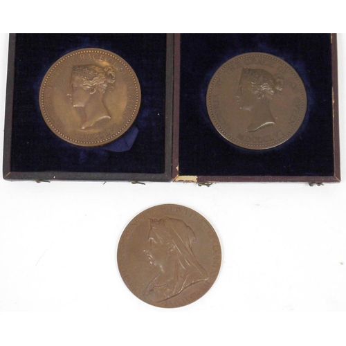 200 - Three Victorian bronze medallions, two cased dated 1856, one a local prize and the other a national ... 