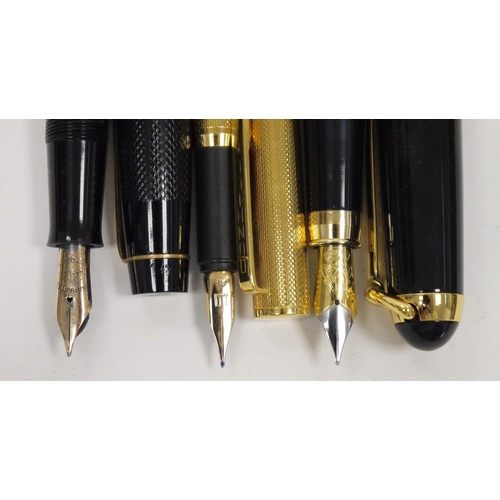 225 - Three fountain pens, including a cased Dunhill gold plated fountain pen with 14ct nib, an Onoto The ... 