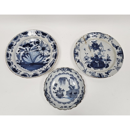 53 - Two 18th century delft tin glazed blue and white dishes and a similar charger, the charger decorated... 