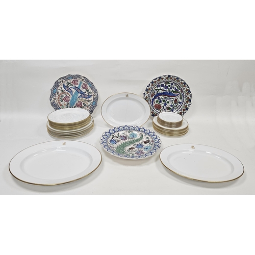 80 - Wedgwood and Spode dinner ware and three Isnik chargers, white ground with gilt decoration to the ri... 