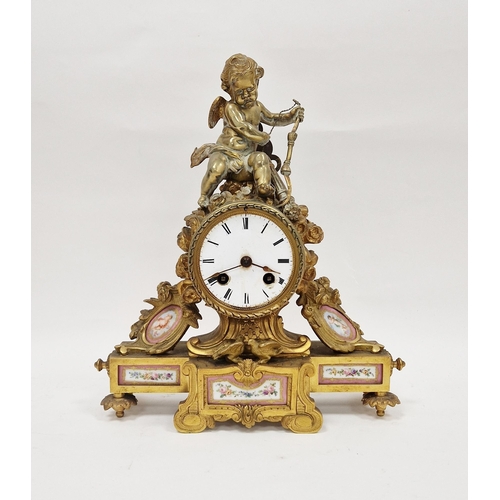 1011A - 19th century Frenh style ormolu mantel clock topped with cupid, circular enamel dial with Roman nume... 