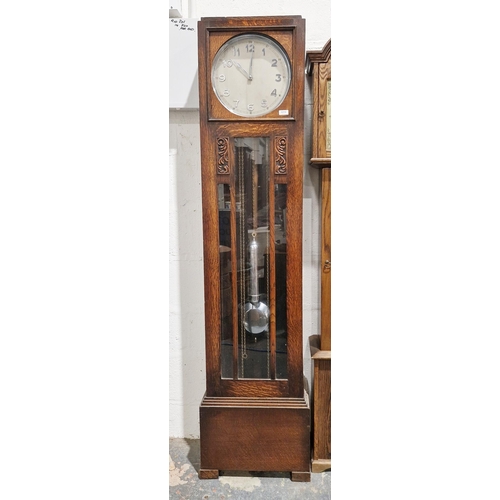 1016 - Art Deco oak triple weight longcase clock with stepped oak hood and glazed panel door, the silver an... 