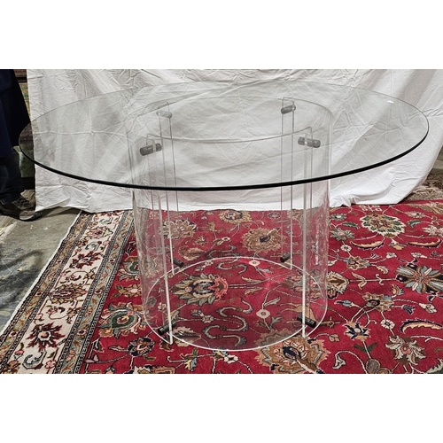 1029 - Contemporary circular dining table, the circular clear glass top supported on two joined clear lucit... 