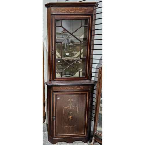 1031 - Early 20th century mahogany and satinwood corner cabinet inlaid with a basket and swags and bows, th... 