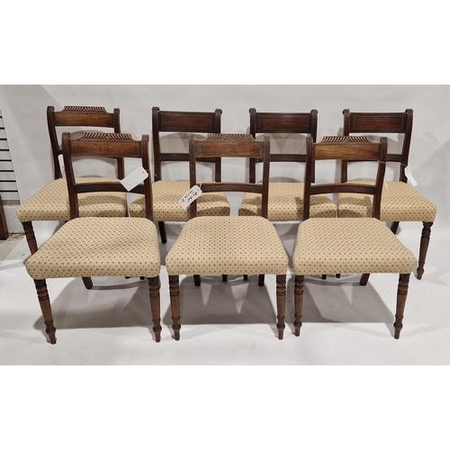 1050 - Set of three Regency mahogany brass inlaid dining chairs, each with reeded supports with stuffover s... 