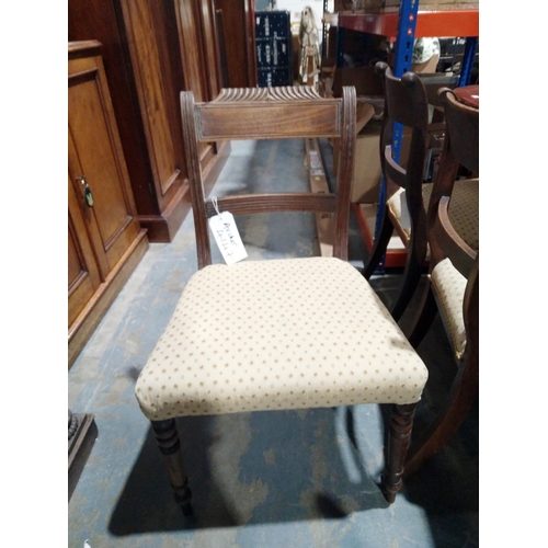 1050 - Set of three Regency mahogany brass inlaid dining chairs, each with reeded supports with stuffover s... 