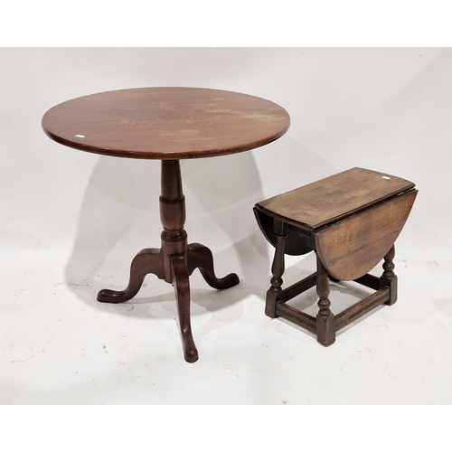 1066 - George III mahogany supper table, the circular tilt-top raised on a turned column support with three... 