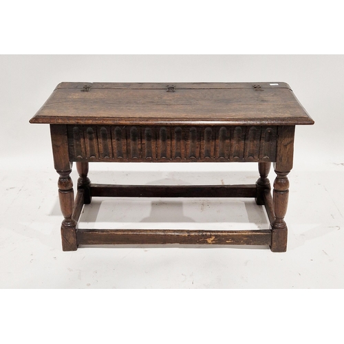 1106 - Oak jointed box stool in the 17th century manner, with a hinged lid above a frieze with thumbnail ca... 