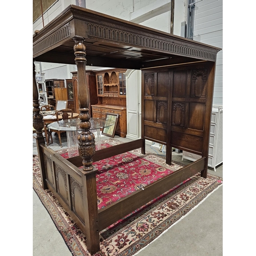 1148 - Oak double tester bed frame in the Jacobean 17th century manner, with thumbnail carving to frieze, c... 