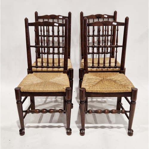 1158 - A set of four Lancashire style ash dining chairs the backs with a double row of spindles, rush seats... 