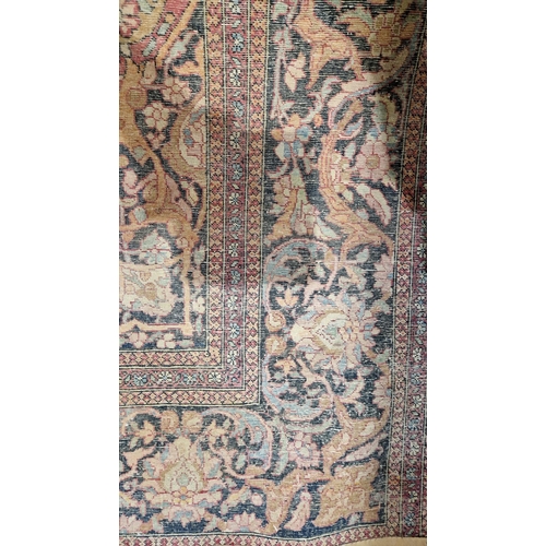 1212 - Eastern wool rug of Persian design, having black arabesque to the cherry red field with allover flor... 