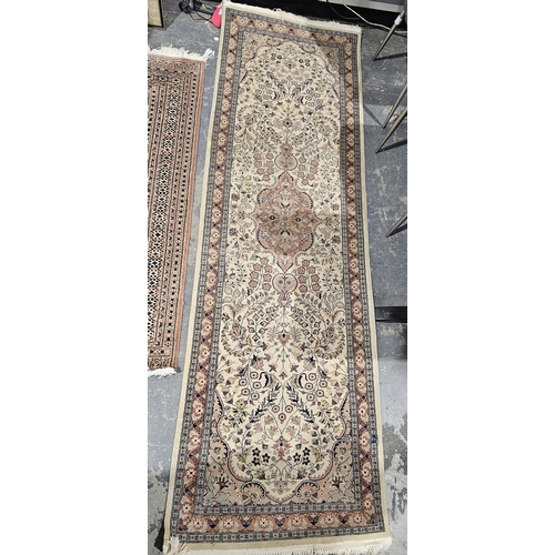 1220 - Pakistani Kashan beige double knotted wool ground runner, with central floral medallion on floral fi... 