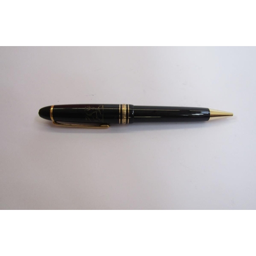 131B - Montblanc Meisterstuck ball point pen, black with gold band decoration, engraved lion crest and name... 