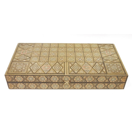 162 - Anglo Indian parquetry backgammon box with various modern game pieces to the interior, 50cm long