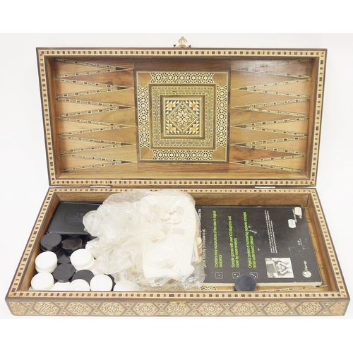 162 - Anglo Indian parquetry backgammon box with various modern game pieces to the interior, 50cm long