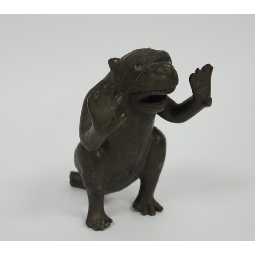 188 - Early 20th century bronze model of a monkey, seated and holding its arms as if in support, jaw open ... 