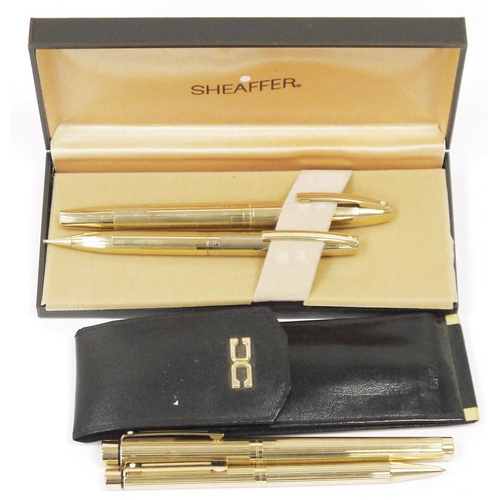 204 - Two Sheaffer fountain and ball point pen sets including set in hard case with gold tone partially ri... 