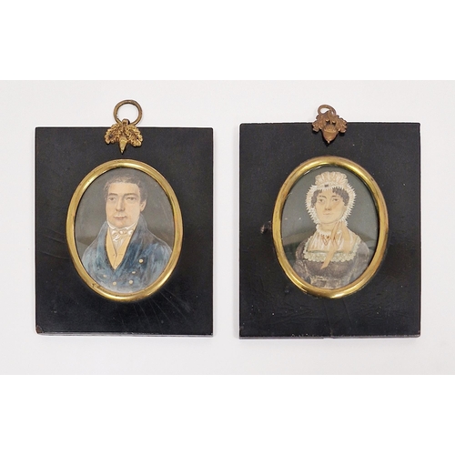 257A - Two 19th century portrait miniatures of lady and gentleman, both mounted in ebonised frames and glaz... 