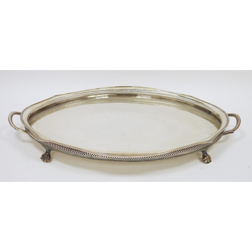 295 - Large early 20th century oval two-handled EPNS galleried tray with beaded rim, raised on four paw fe... 